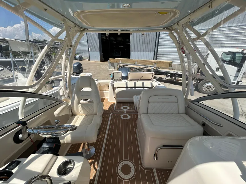 Slide: The Image of 2018 Grady-White Freedom 235 boat interior with luxurious seating and modern design. - 33