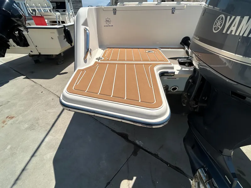 Slide: The Image of 2018 Grady-White Freedom 235 boat with Yamaha outboard motor and swim platform. - 4
