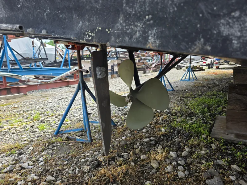 Slide: The Image of Propeller and rudder of 1988 Marinette 37 Motor Yacht on dry dock. - 13