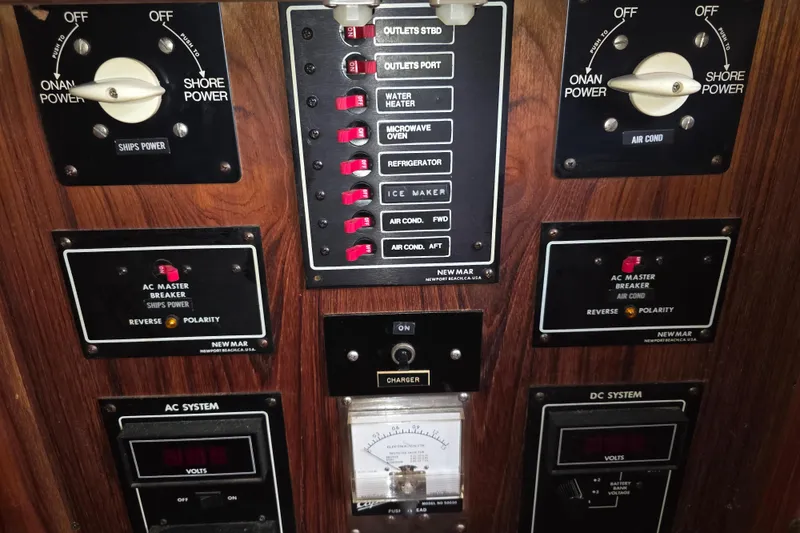 Slide: The Image of Electrical control panel of a 1988 Marinette 37 Motor Yacht with switches and meters. - 44