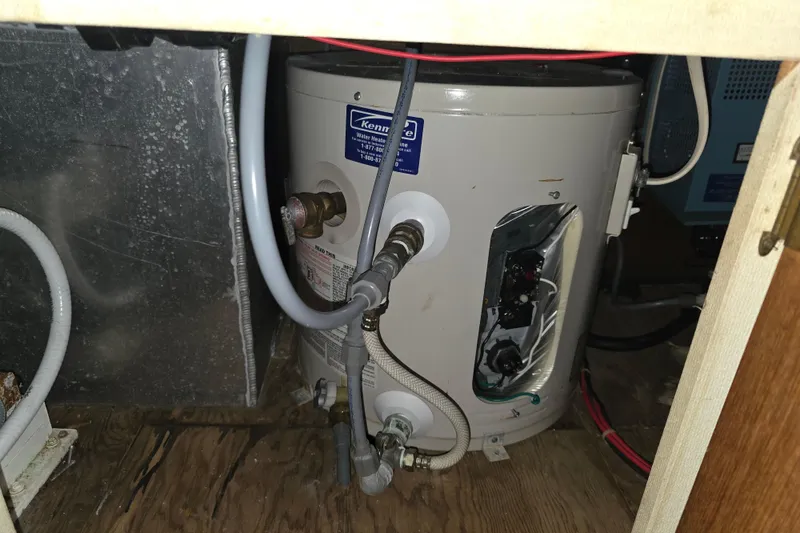 Slide: The Image of Water heater installation in 1988 Marinette 37 Motor Yacht engine room. - 57