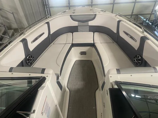 Slide: The Image of 2018 Chaparral 267 SSX boat interior with cushioned seating and modern design. - 10