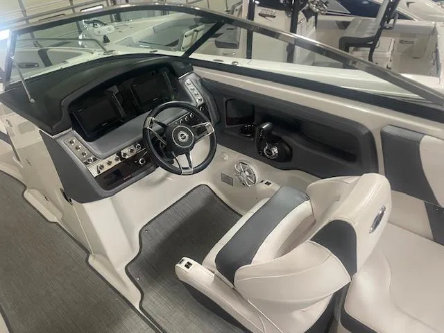 Slide: The Image of 2018 Chaparral 267 SSX boat interior with modern dashboard and steering wheel. - 12