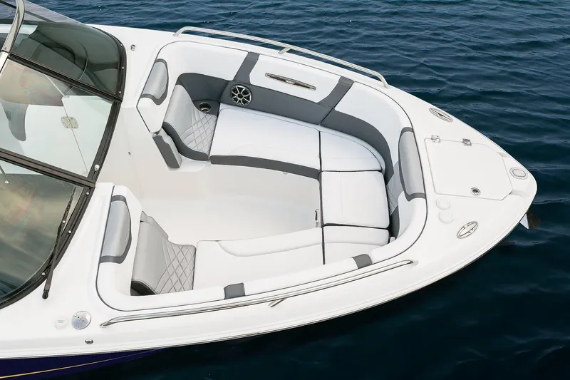 Slide: The Image of Manufacturer Provided Image: 2018 Chaparral 267 SSX boat interior with white and gray seating on water. - 19