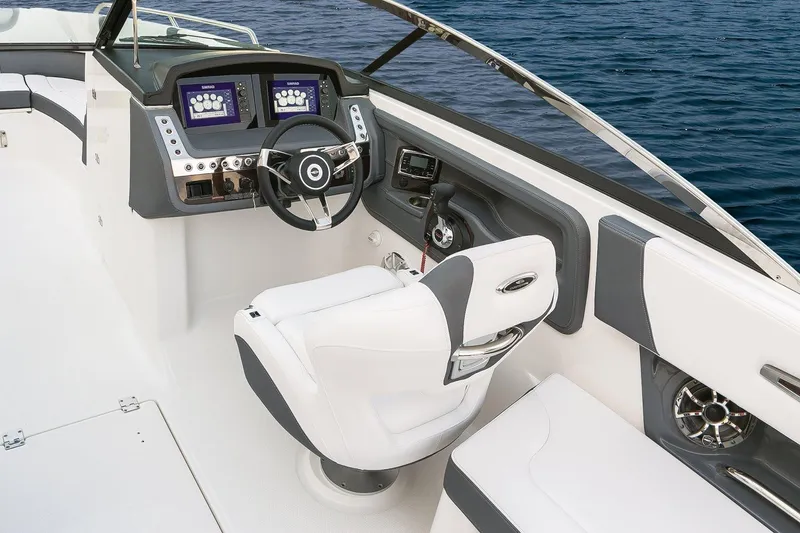 Slide: The Image of Manufacturer Provided Image: 2018 Chaparral 267 SSX boat cockpit with modern dashboard and white seating. - 22