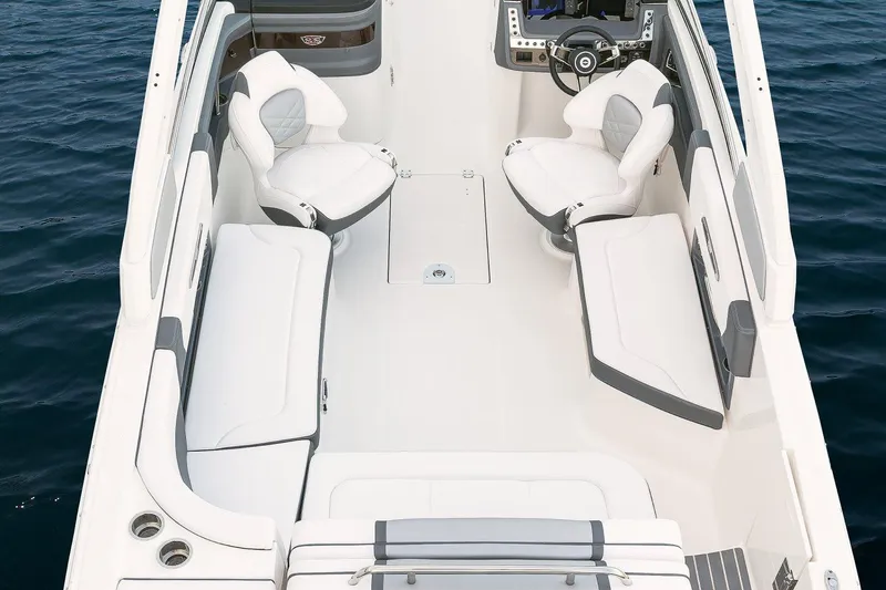 Slide: The Image of Manufacturer Provided Image: 2018 Chaparral 267 SSX boat interior with white seating and steering console. - 24