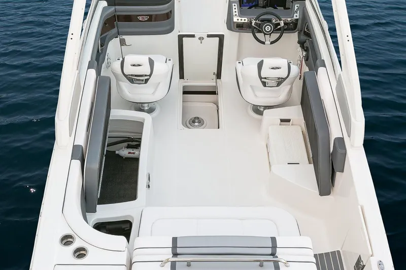 Slide: The Image of Manufacturer Provided Image: 2018 Chaparral 267 SSX boat interior with seating and steering wheel. - 25