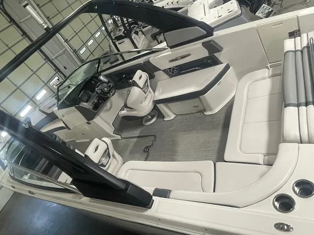 Slide: The Image of 2018 Chaparral 267 SSX boat interior with sleek seating and modern design. - 7