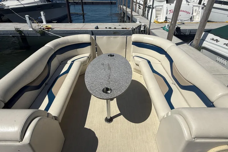 Slide: The Image of Luxurious 2016 Custom King Mariner boat interior with plush seating and oval table. - 17