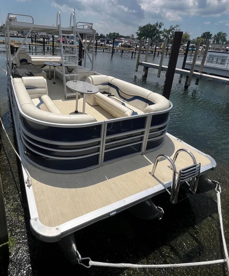 Slide: The Image of Pontoon boat docked, 2016 Custom King Mariner, featuring spacious seating and ladder. - 3