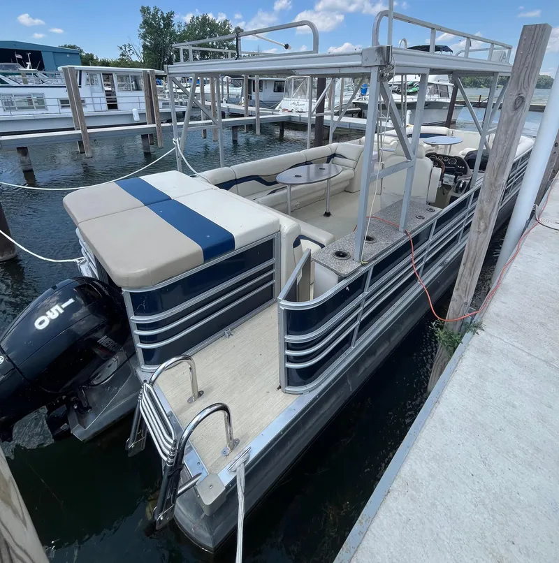 Slide: The Image of 2016 Custom King Mariner pontoon boat docked at marina. - 7