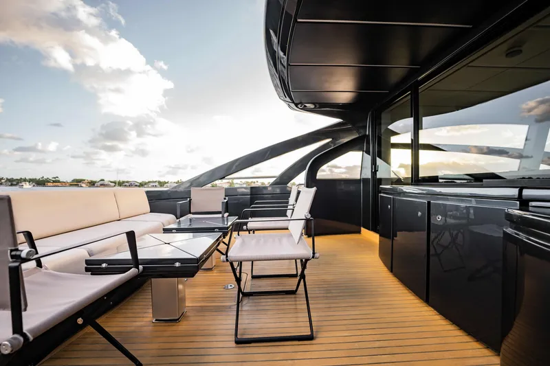 Slide: The Image of Luxurious 2017 Pershing 70 yacht deck with modern seating and sleek design. - 13