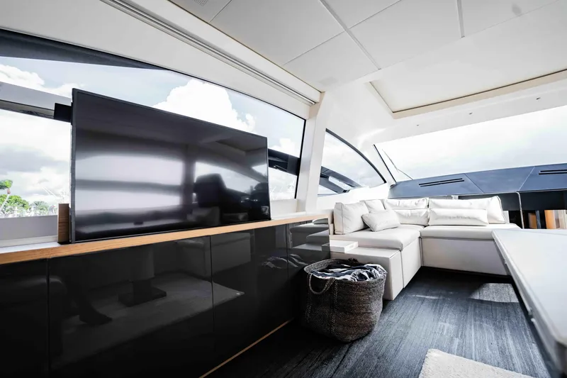 Slide: The Image of Luxurious interior of 2017 Pershing 70 yacht with modern seating and large TV. - 17
