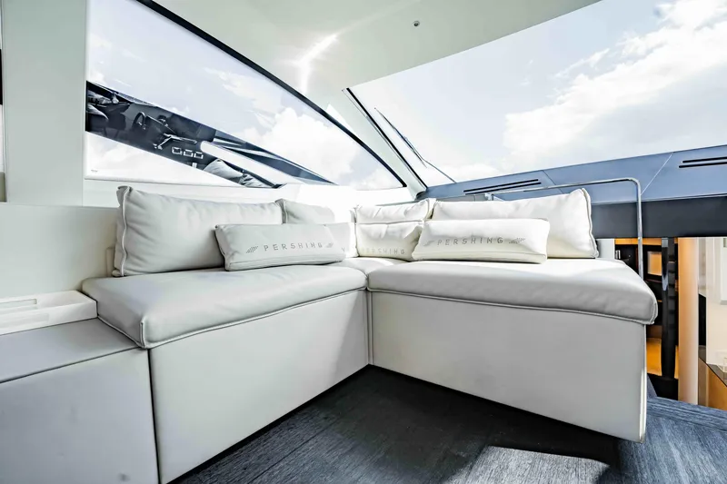 Slide: The Image of Luxurious interior of 2017 Pershing 70 yacht with plush white seating and cushions. - 19