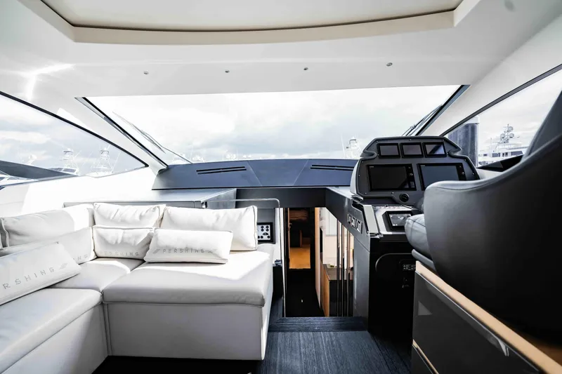 Slide: The Image of Luxurious interior of 2017 Pershing 70 yacht with modern helm and plush seating. - 20