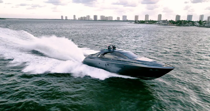 Slide: The Image of Luxurious 2017 Pershing 70 yacht cruising swiftly on open water. - 3