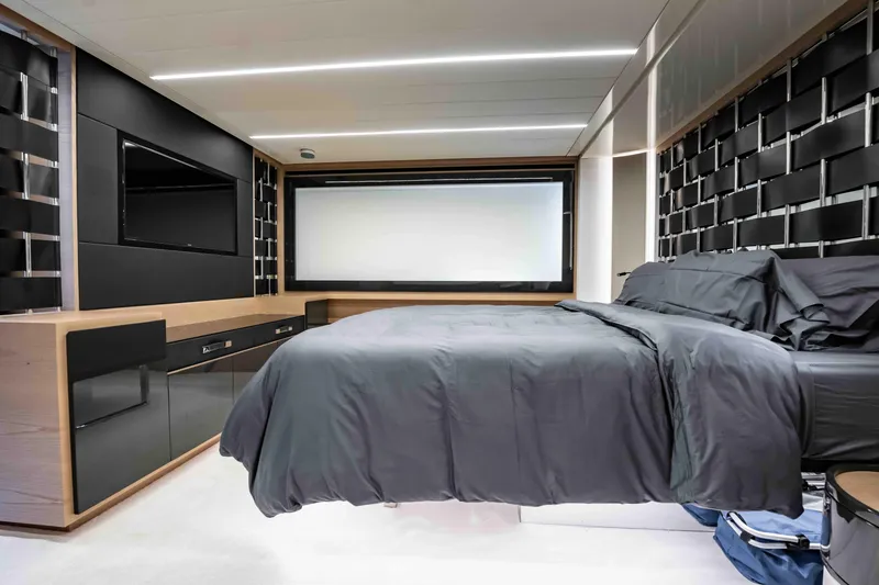 Slide: The Image of Luxurious bedroom interior of 2017 Pershing 70 yacht with modern design and sleek furnishings. - 31