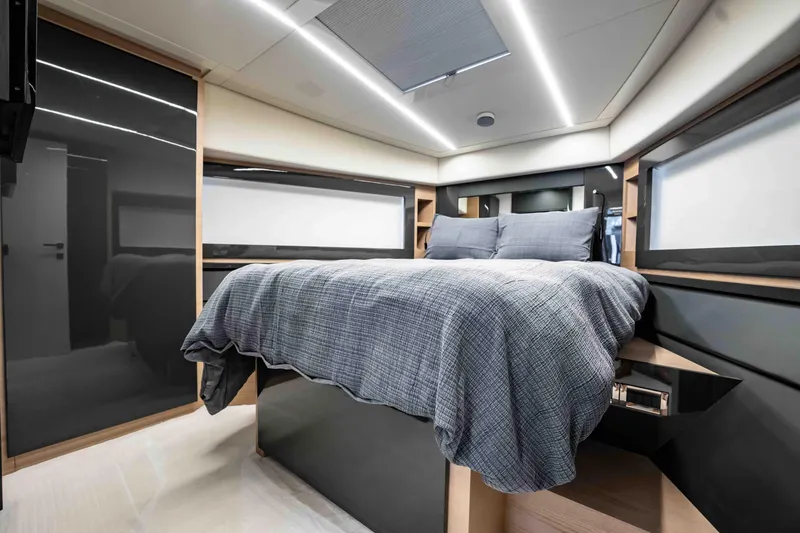 Slide: The Image of Luxurious bedroom interior of 2017 Pershing 70 yacht with modern design and cozy bedding. - 34