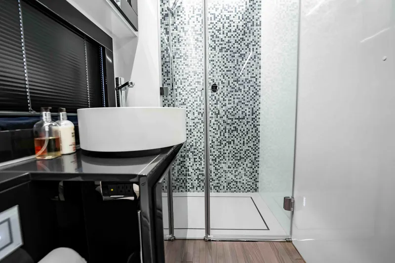 Slide: The Image of Luxurious bathroom in 2017 Pershing 70 yacht with modern sink and glass shower. - 36