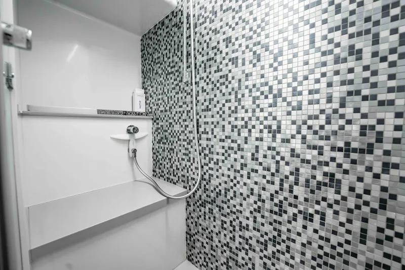 Slide: The Image of Modern shower with mosaic tiles in 2017 Pershing 70 yacht bathroom. - 37