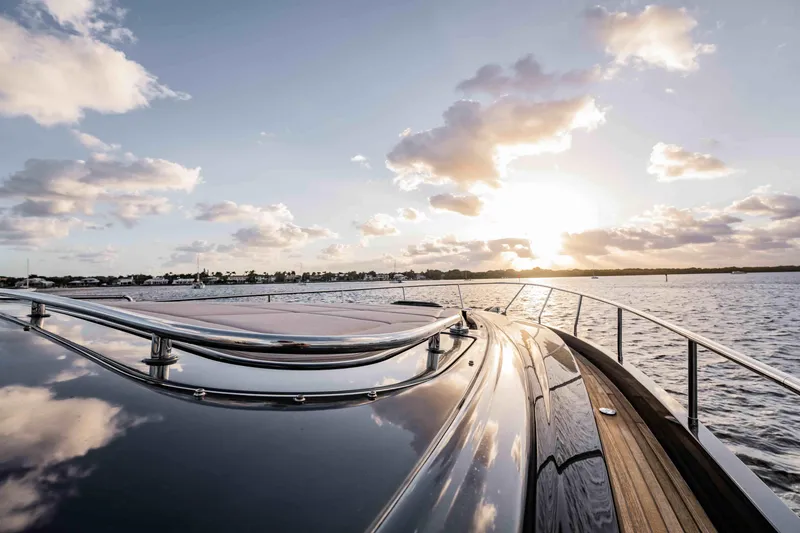 Slide: The Image of Luxurious 2017 Pershing 70 yacht cruising at sunset on calm waters. - 42