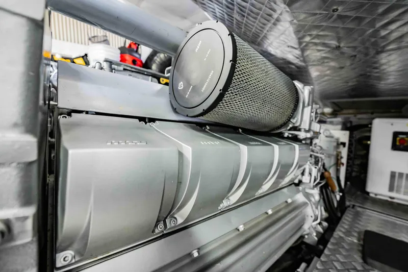 Slide: The Image of Engine room of a 2017 Pershing 70 yacht, showcasing advanced machinery. - 47