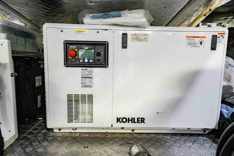 Slide: The Image of Kohler generator in a 2017 Pershing 70 yacht engine room. - 48