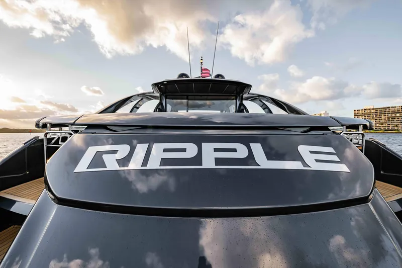 Slide: The Image of 2017 Pershing 70 yacht named "RIPPLE" on water, showcasing sleek design and luxury features. - 5