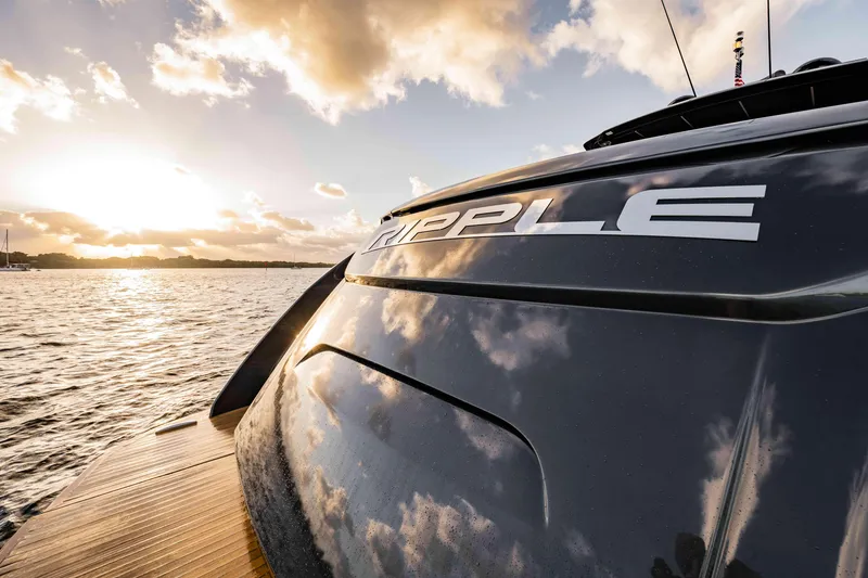 Slide: The Image of 2017 Pershing 70 yacht "Ripple" at sunset on the water. - 6