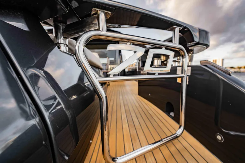Slide: The Image of Luxurious 2017 Pershing 70 yacht with sleek design and wooden deck. - 7