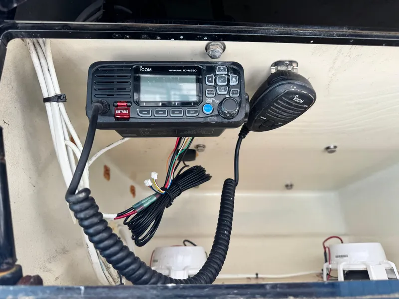 Slide: The Image of VHF marine radio in 2022 Twin Vee 310 CC GF Classic boat console. - 12