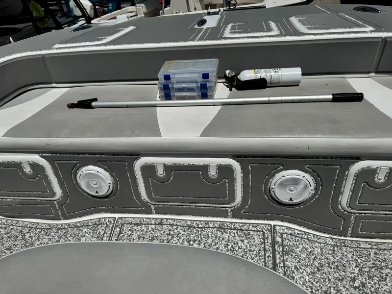 Slide: The Image of 2022 Twin Vee 310 CC GF Classic boat deck with storage compartments and equipment. - 5