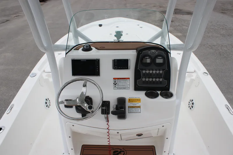 Slide: The Image of 2017 Sea Fox 220 Viper boat console with steering wheel and navigation controls. - 12