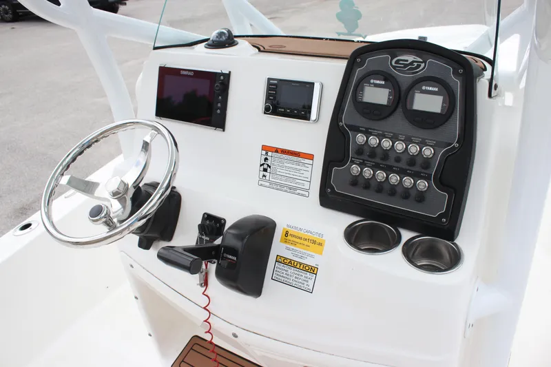 Slide: The Image of 2017 Sea Fox 220 Viper boat dashboard with steering wheel and control panel. - 13