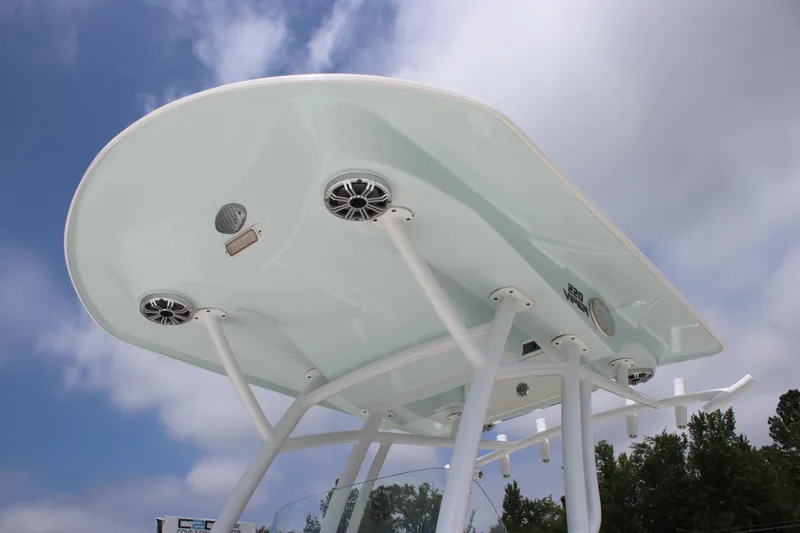 Slide: The Image of 2017 Sea Fox 220 Viper boat T-top with speakers against a cloudy sky. - 21