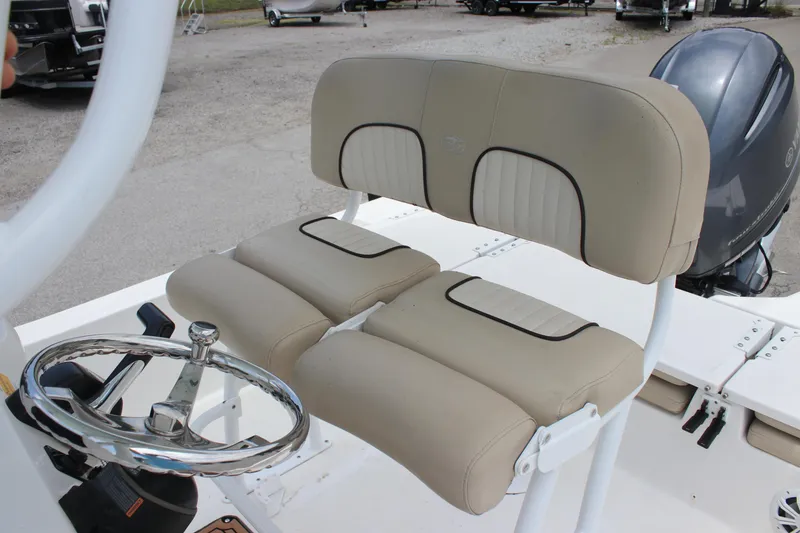 Slide: The Image of 2017 Sea Fox 220 Viper boat seat and steering wheel, showcasing beige upholstery and chrome details. - 23