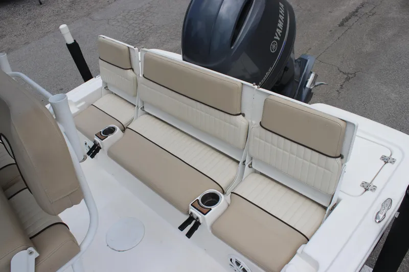 Slide: The Image of 2017 Sea Fox 220 Viper boat seating with Yamaha engine, featuring beige cushioned seats. - 24