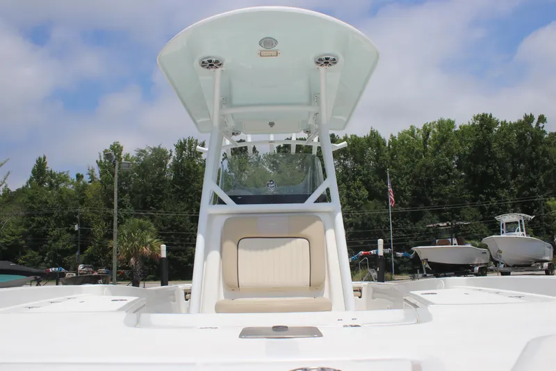Slide: The Image of 2017 Sea Fox 220 Viper boat with T-top and seating, docked outdoors. - 26