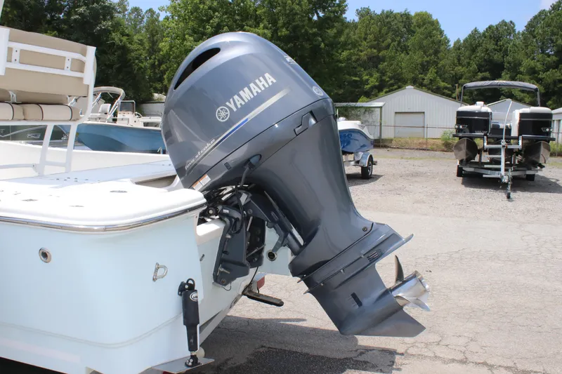 Slide: The Image of 2017 Sea Fox 220 Viper with Yamaha outboard motor in a boatyard setting. - 33