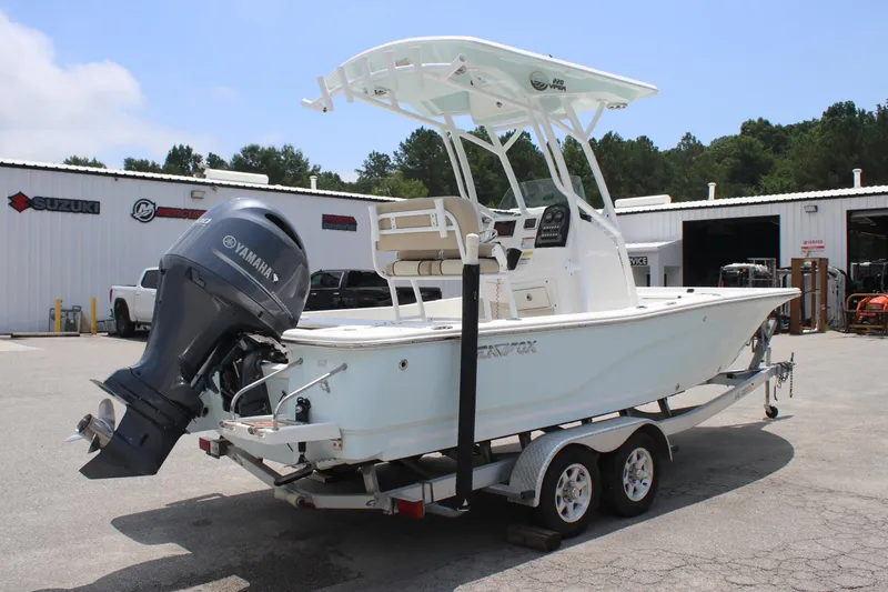 Slide: The Image of 2017 Sea Fox 220 Viper boat on trailer with Yamaha outboard motor, parked outdoors. - 4