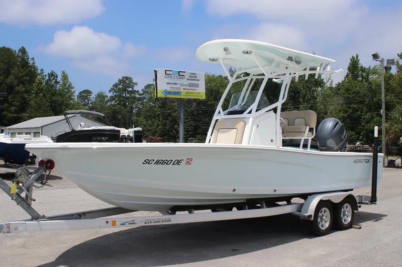 Slide: The Image of 2017 Sea Fox 220 Viper boat on trailer, parked outdoors under a clear sky. - 7