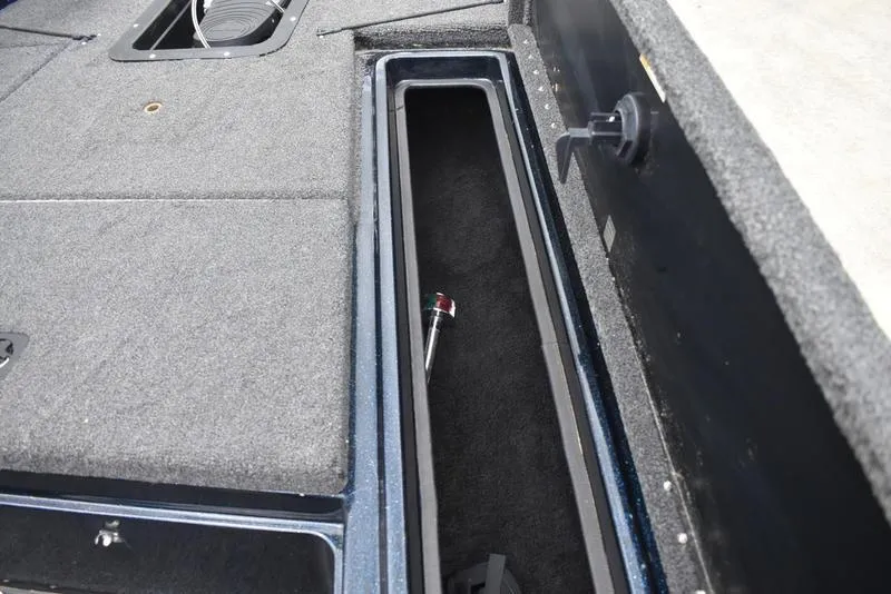 Slide: The Image of 1997 Stratos 282 DC boat interior storage compartment with carpeted finish. - 10
