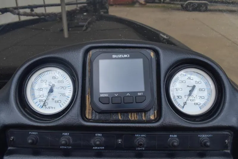 Slide: The Image of Dashboard of a 1997 Stratos 282 DC boat with Suzuki display and gauges. - 18