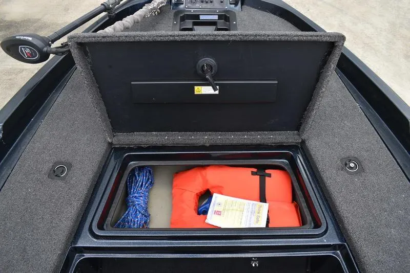 Slide: The Image of Storage compartment of a 1997 Stratos 282 DC boat with life jacket and rope. - 9