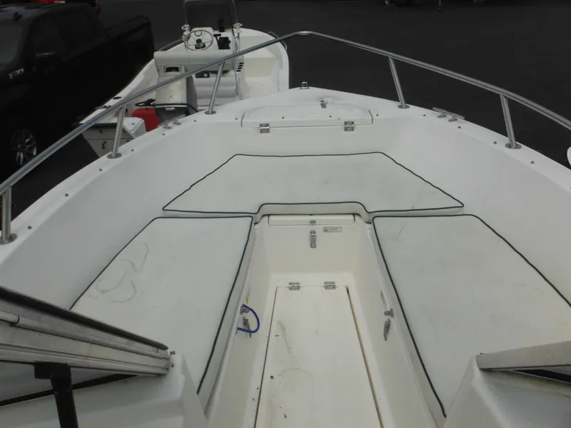 Slide: The Image of 1996 Hydra-Sports 2000 DC boat interior with cushioned seating and steering console. - 12