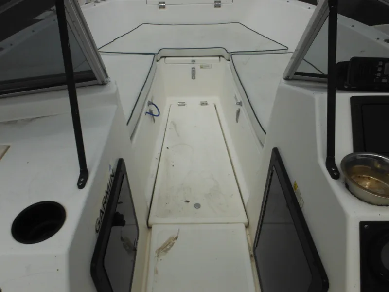 Slide: The Image of 1996 Hydra-Sports 2000 DC boat interior with seating and storage compartments. - 13