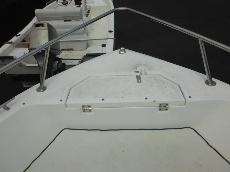 Slide: The Image of 1996 Hydra-Sports 2000 DC boat deck with railing and storage compartment. - 14