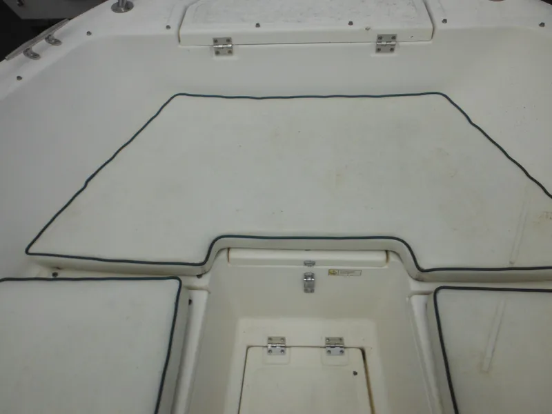 Slide: The Image of 1996 Hydra-Sports 2000 DC boat interior with cushioned seating and storage compartments. - 18