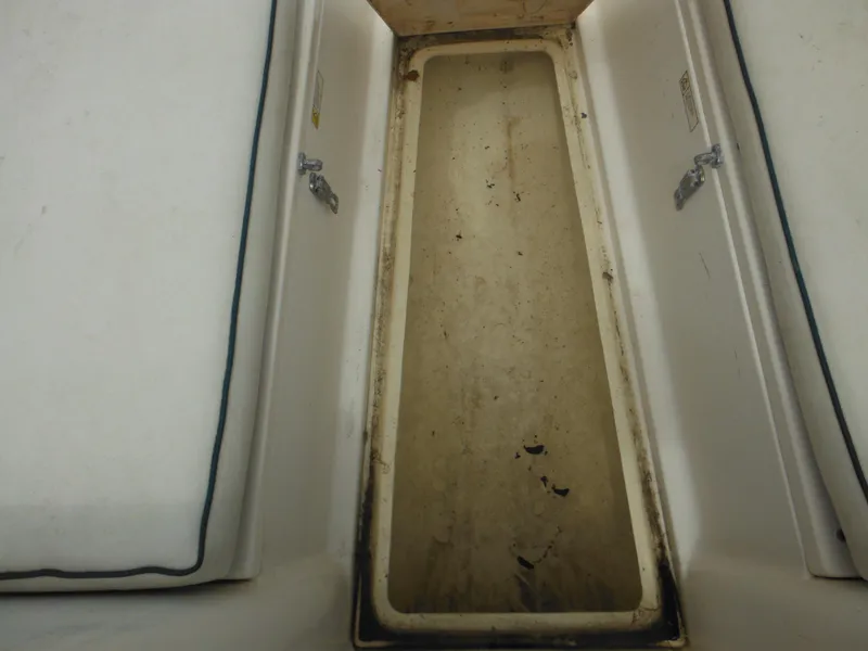 Slide: The Image of Storage compartment of a 1996 Hydra-Sports 2000 DC boat, showing interior details. - 23