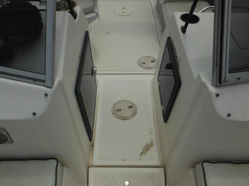 Slide: The Image of 1996 Hydra-Sports 2000 DC boat interior with storage compartments and seating area. - 24